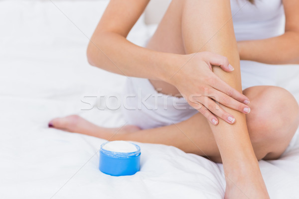 Woman putting some moisturiser Stock photo © wavebreak_media
