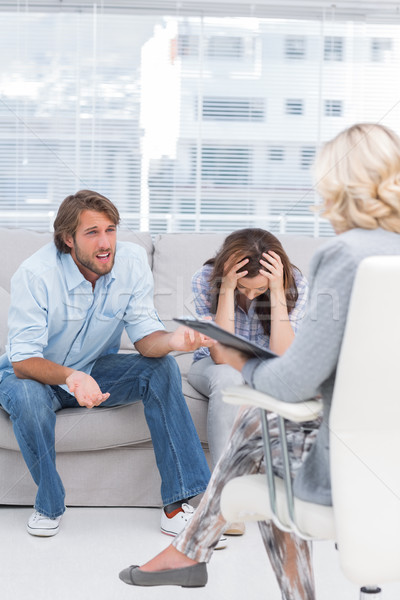 Therapist listening to the couple sit on the couch Stock photo © wavebreak_media