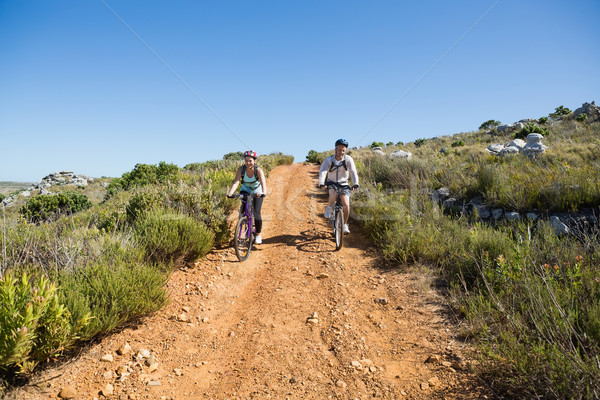 Active couple cycling on country terrain together Stock photo © wavebreak_media