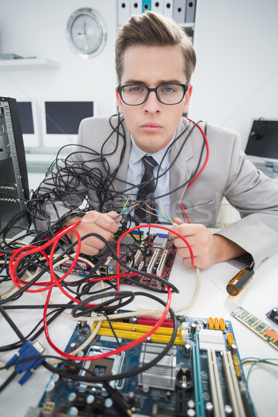 Computer engineer working on broken cables Stock photo © wavebreak_media