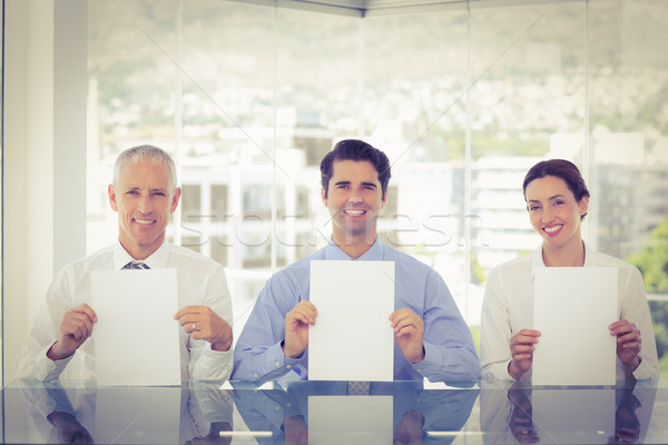 Sorridente equipe de negócios papel escritório negócio Foto stock © wavebreak_media