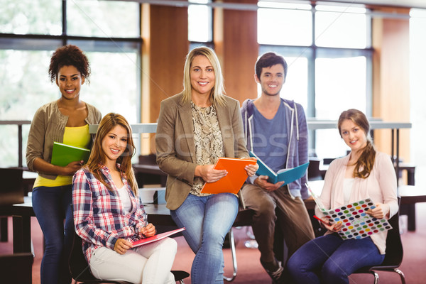 Souriant élèves bibliothèque livre [[stock_photo]] © wavebreak_media