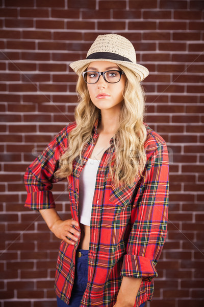 Gorgeous blonde hipster with hand on hips Stock photo © wavebreak_media