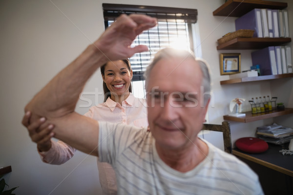 Souriant Homme médecin regarder supérieurs Homme [[stock_photo]] © wavebreak_media