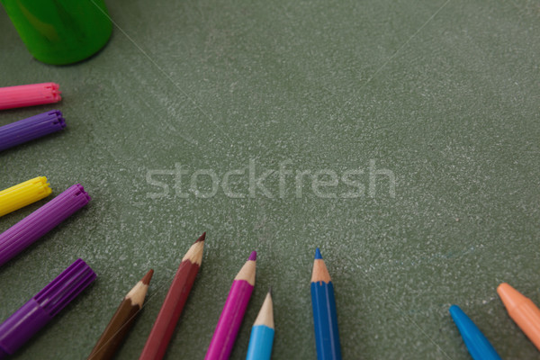 Various color pencils and marker pens on chalkboard Stock photo © wavebreak_media