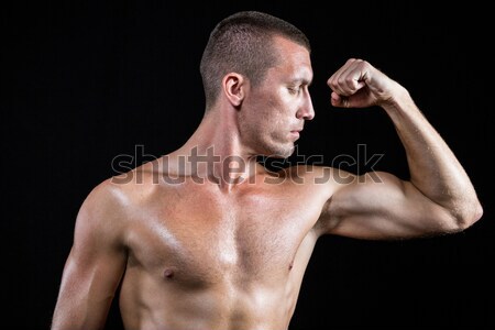 Serious shirtless athlete flexing muscles Stock photo © wavebreak_media