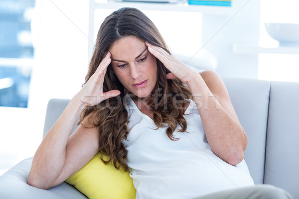 Depressed pregnant woman sitting on sofa Stock photo © wavebreak_media
