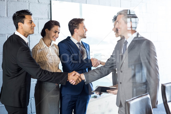 Imprenditore stringe la mano squadra ufficio business donna Foto d'archivio © wavebreak_media