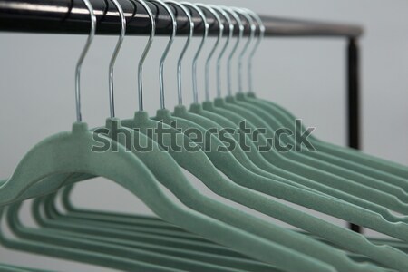 Stock photo: Colorful t-shirts arranged in a row on cloth rack