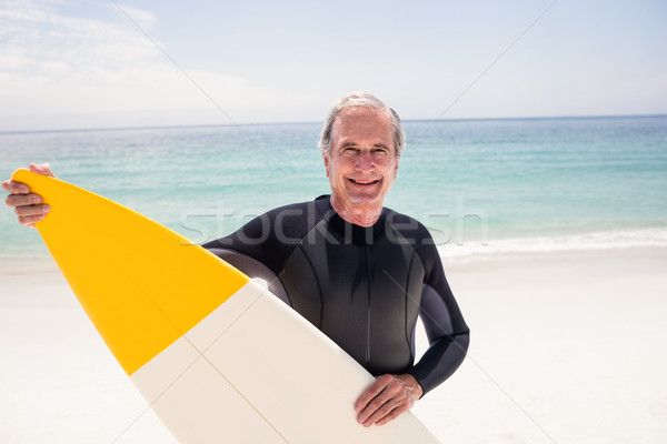 Retrato senior homem prancha de surfe praia Foto stock © wavebreak_media