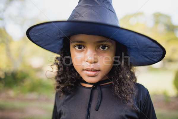 Portrait of cute girl dressing up as witch Stock photo © wavebreak_media