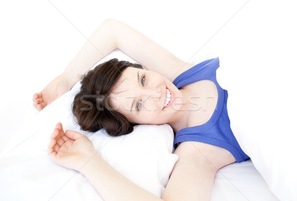 Close-up of a smiling woman waking up slowly Stock photo © wavebreak_media