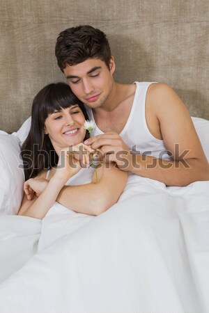 Young couple against white background surfing on internet Stock photo © wavebreak_media