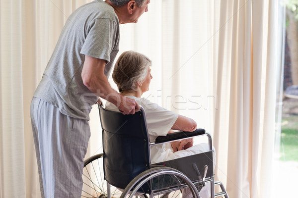 Retired couple looking out the window Stock photo © wavebreak_media