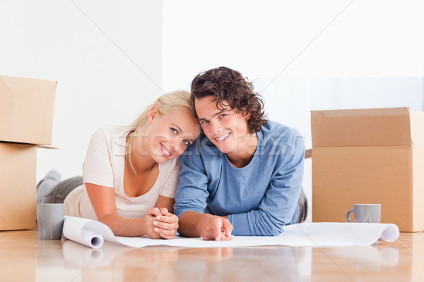 Couple organizing their future home surrounded by boxes Stock photo © wavebreak_media