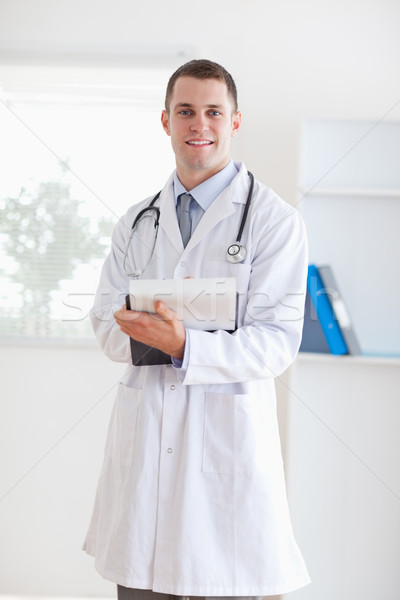 Smiling doctor having good news Stock photo © wavebreak_media