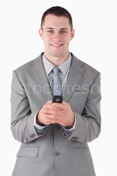 Porträt Geschäftsmann halten Mobiltelefon weiß Lächeln Stock foto © wavebreak_media