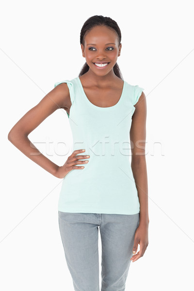 Close up of smiling woman with one arm akimbo on white background Stock photo © wavebreak_media