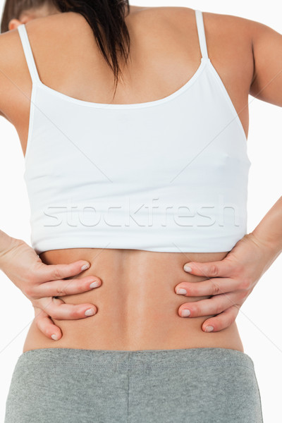 Back view of female with back pain against a white background Stock photo © wavebreak_media