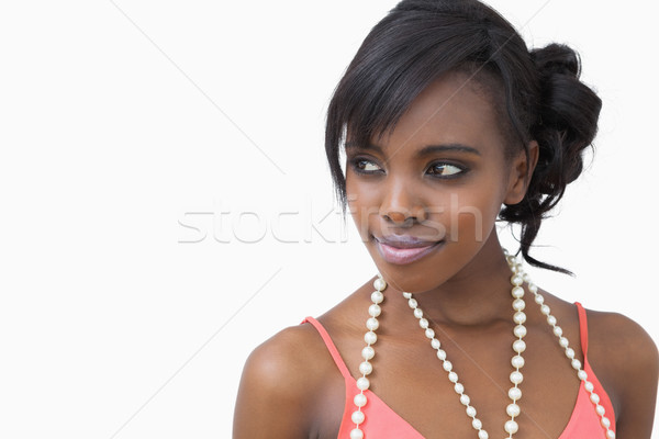 Stock photo: Smiling Woman Wearing A Pearl Necklace On White Background