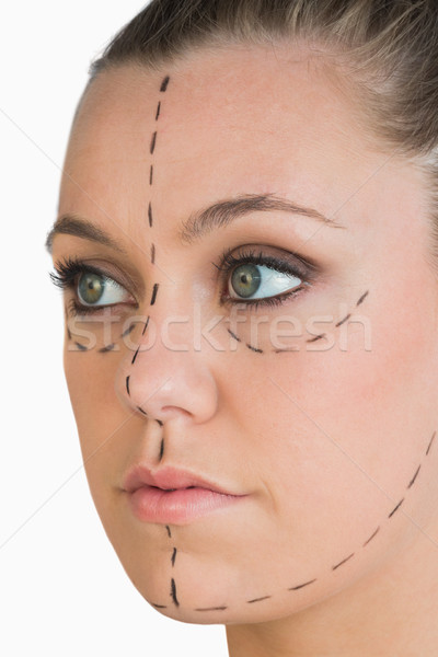 Blonde with markings for a face lift on whit background Stock photo © wavebreak_media