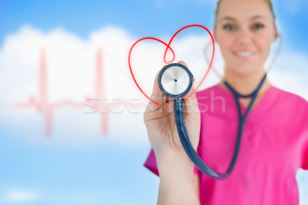 Fericit asistentă stetoscop inimă proiect Imagine de stoc © wavebreak_media