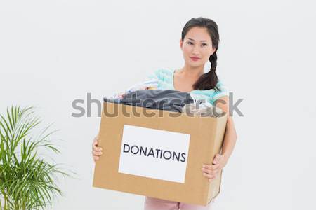 Young woman with clothes donation Stock photo © wavebreak_media