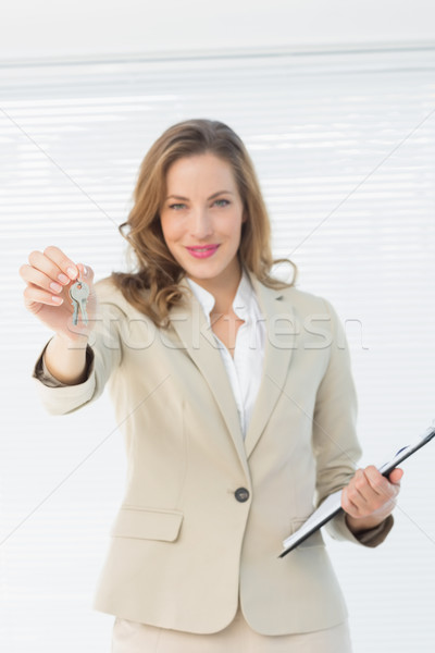Portrait of a beautiful woman handing over house keys Stock photo © wavebreak_media