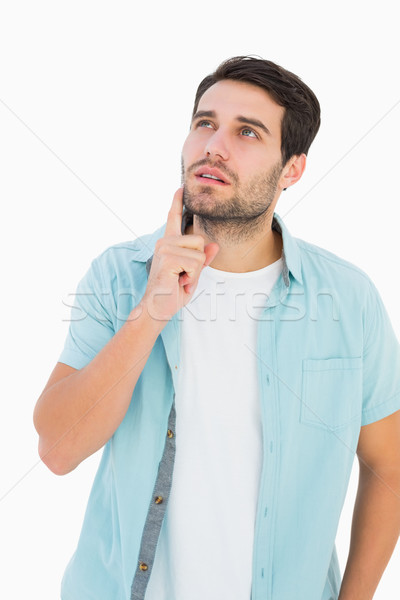 Happy casual man thinking with hand on chin Stock photo © wavebreak_media