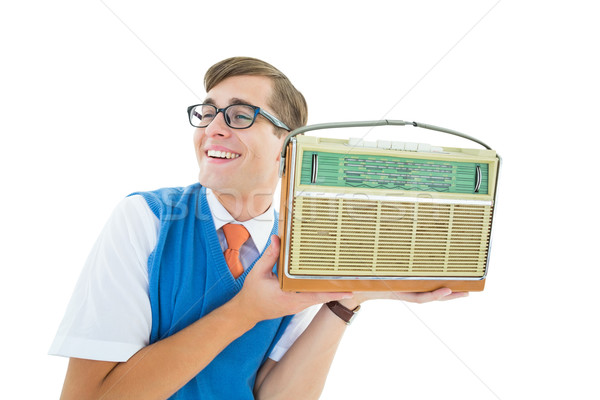 Stock photo: Geeky hipster listening to retro radio