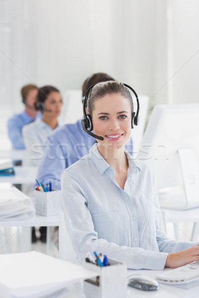 Business team working on computers and wearing headsets Stock photo © wavebreak_media