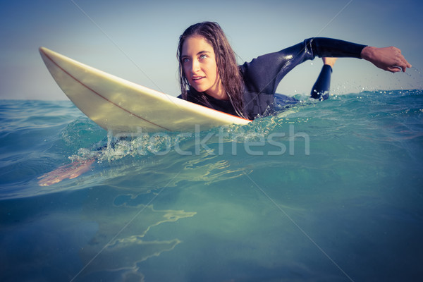 woman in wetsuit surfing Stock photo © wavebreak_media