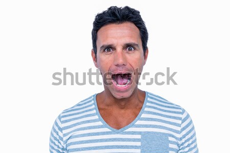 Shocked man looking at camera Stock photo © wavebreak_media