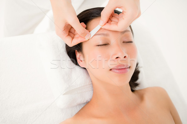 Stock photo: Hand waxing beautiful womans eyebrow
