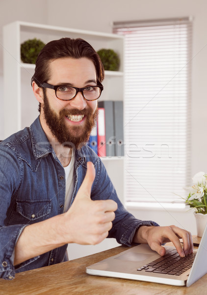 Hipster businessman showing thumbs up to camera Stock photo © wavebreak_media
