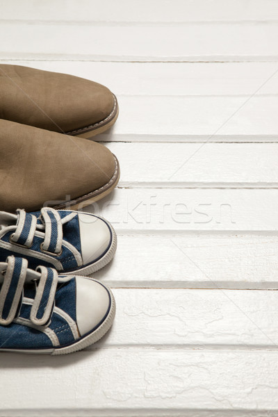Pairs of shoes on white floor Stock photo © wavebreak_media