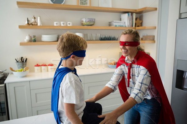 Mother and son pretending to be superhero in the kitchen Stock photo © wavebreak_media