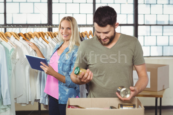 Man separating products while woman holding digital tablet  Stock photo © wavebreak_media