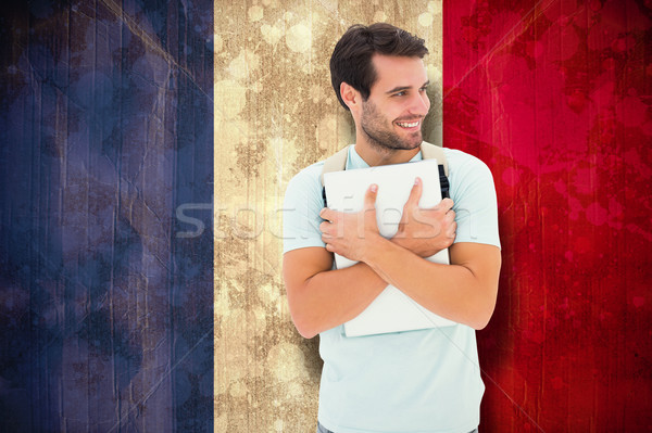 Composite image of student holding laptop Stock photo © wavebreak_media