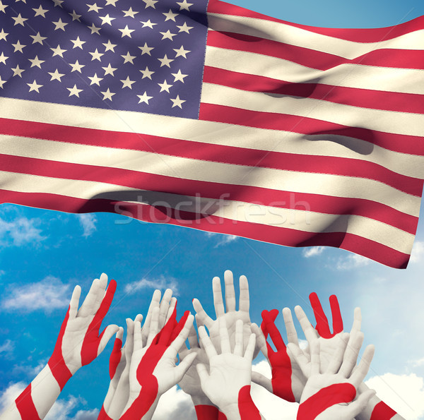 Composite image of people raising hands in the air Stock photo © wavebreak_media