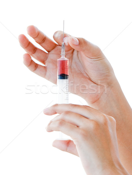 Stock photo: Close-up of a syringe ready for use 