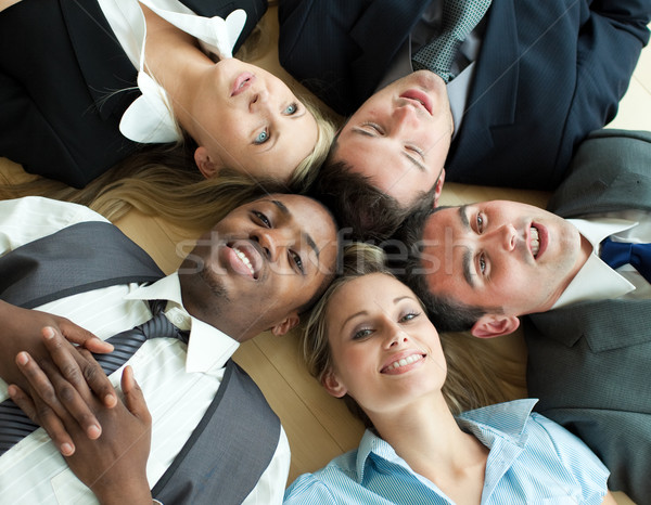 Closse-up of Business people lying in a circle on the floor of the office
 Stock photo © wavebreak_media