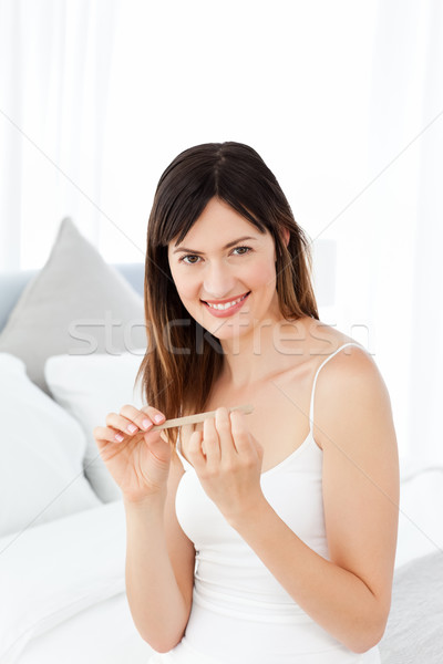 Superb woman filing her nails Stock photo © wavebreak_media