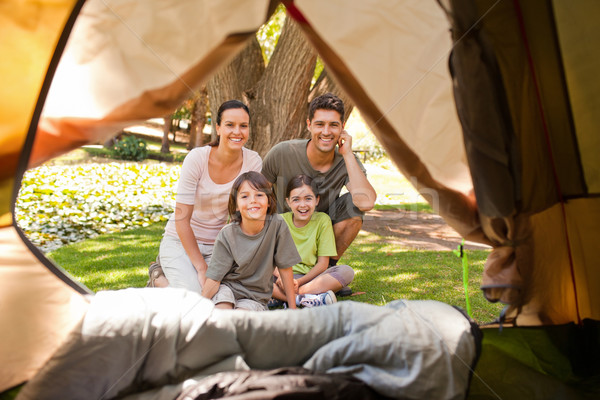 Stock photo: Joyful family camping in the park