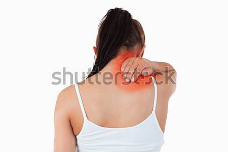 Back view of woman with pain in her neck against a white background Stock photo © wavebreak_media