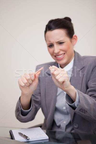 Angry young businesswoman broke her pencil Stock photo © wavebreak_media