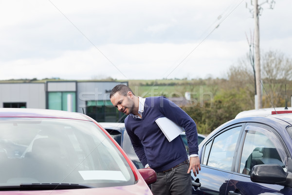 Man looking at a car while leaning outdoors Stock photo © wavebreak_media