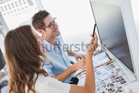 Fotó szerkesztő felfelé néz munka asztal mosolyog Stock fotó © wavebreak_media