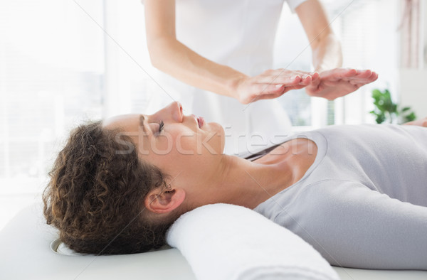 Stock photo: Woman having reiki treatment