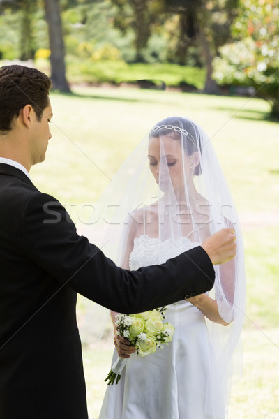 Groom about to lift veil of bride Stock photo © wavebreak_media